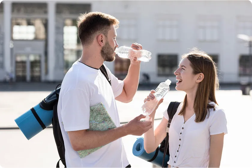Man drinking water to demonstrate how to lower blood pressure instantly and stay hydrated.