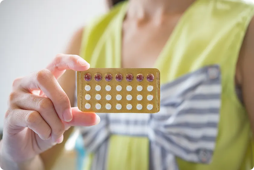 Doctor answering common questions about different birth control methods and effectiveness.