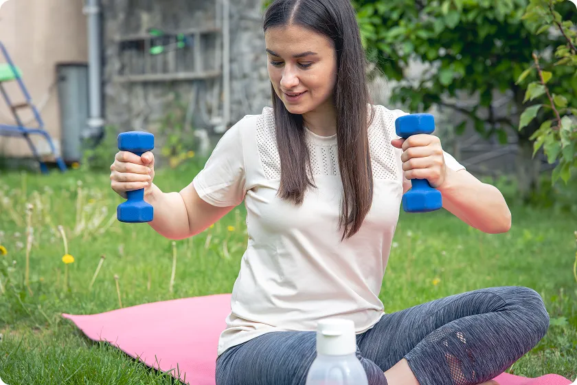 Smiling parent and baby celebrating after completing swimming lessons for infants.