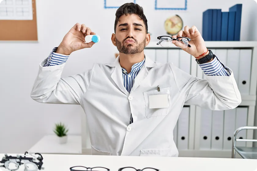 Woman smiling confidently after using proper eye drops for contact lenses daily.