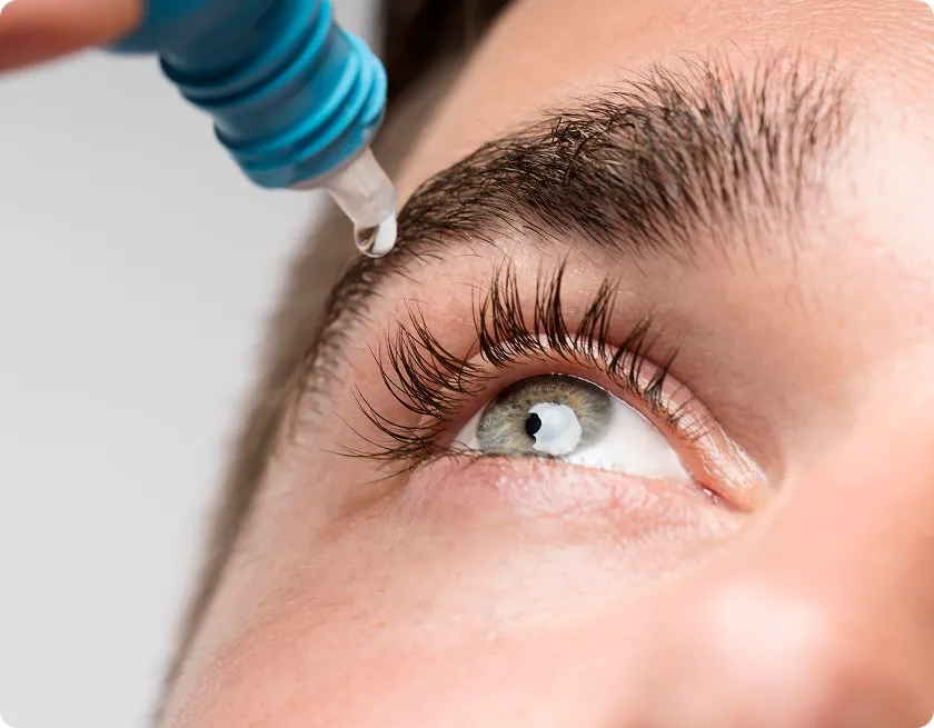 Woman with contact lenses experiencing dryness from low humidity and screen time.