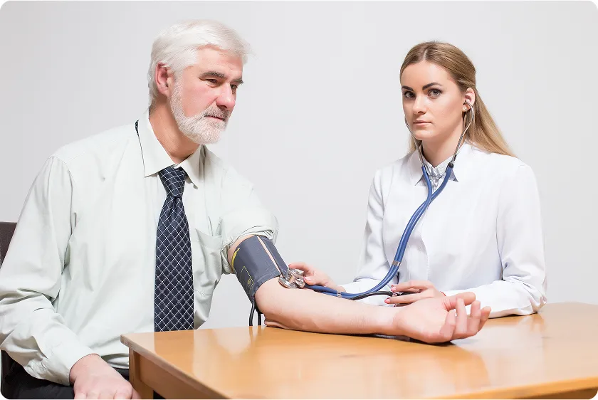 Man drinking water to demonstrate how to lower blood pressure instantly and stay hydrated.