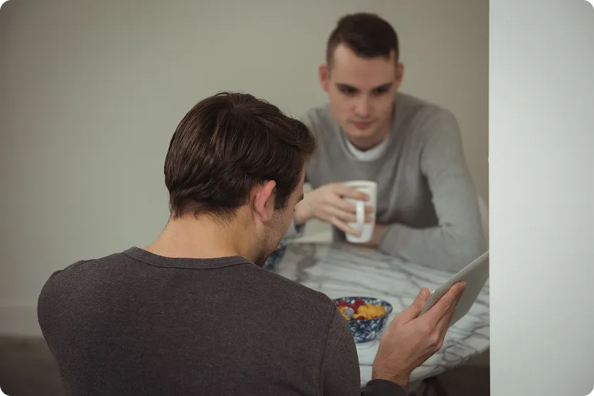 A narcissistic man ignoring a person and being absorbed in his own world, showcasing the traits of a narcissistic man with a lack of empathy and attention towards others.