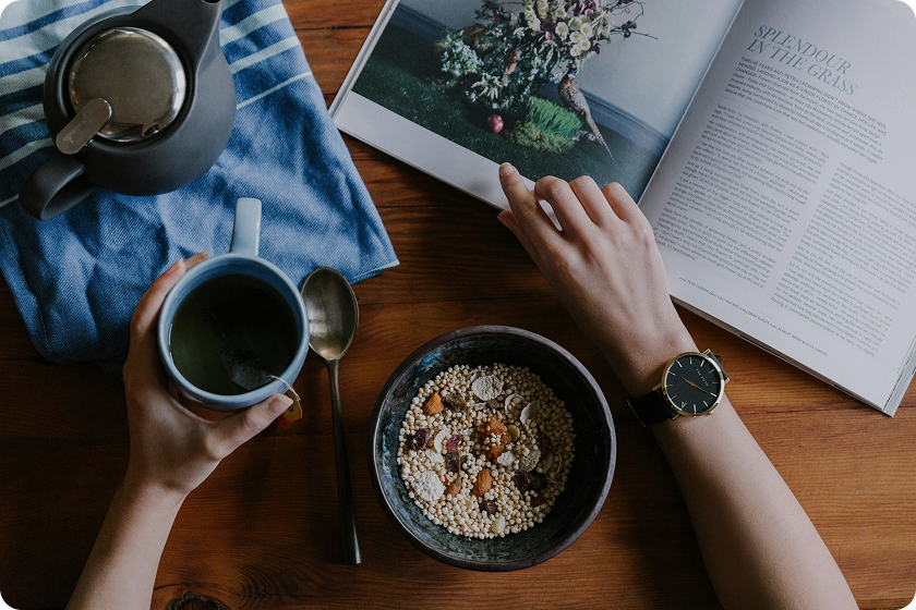 A vibrant morning scene showcasing a healthy morning routine with exercise, meditation, and a nutritious breakfast in a bright, modern setting.
