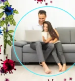 Family relaxing in living room using air purifier for allergies and home air quality testing.