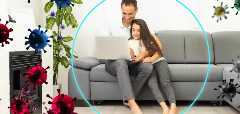 Family relaxing in living room using air purifier for allergies and home air quality testing.