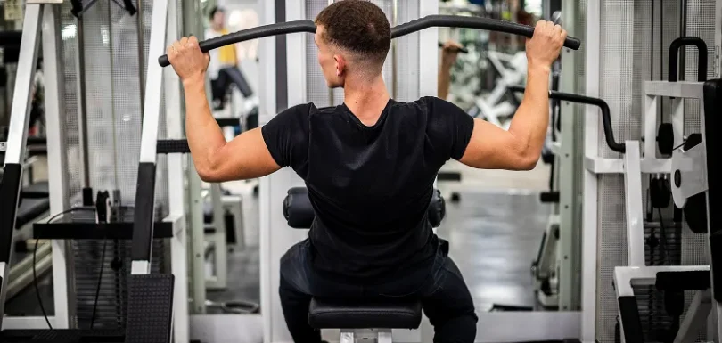 Correct push-up technique in upper body workout for men with dumbbells