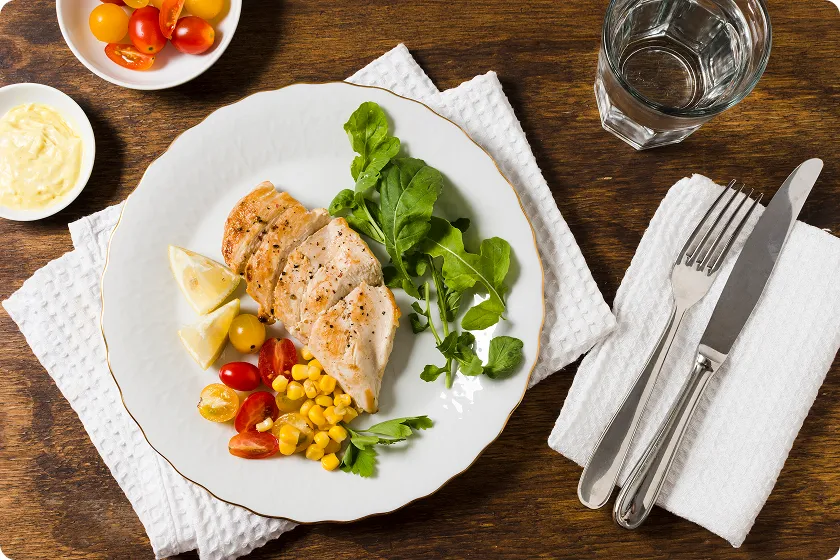 Daily plan illustrating high protein meals for meeting protein goals.