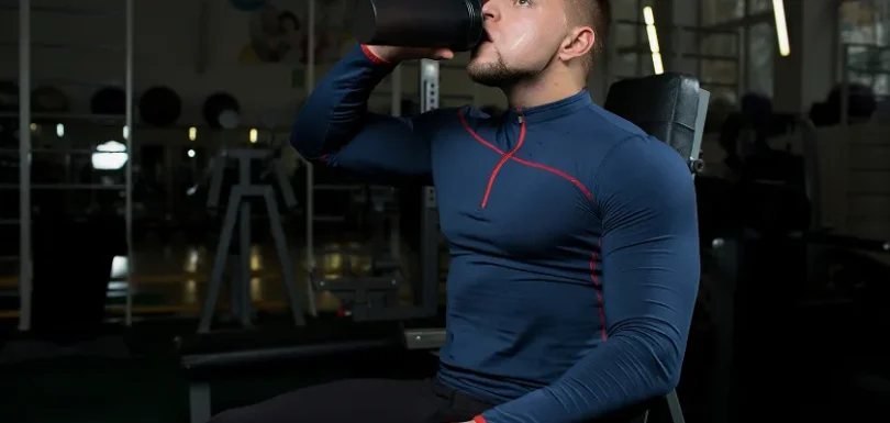 Man adding isolation work to gym workout routine for men to enhance definition.
