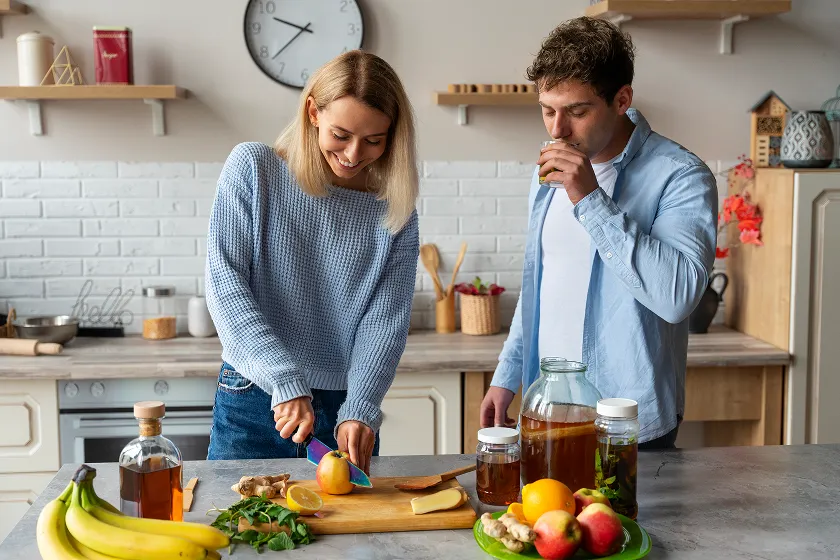 Couple preparing a healthy diet with fiber-rich foods, promoting good digestive health to prevent what is constipation.