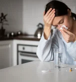 Woman managing sinus infection with sinus pressure after flu relief