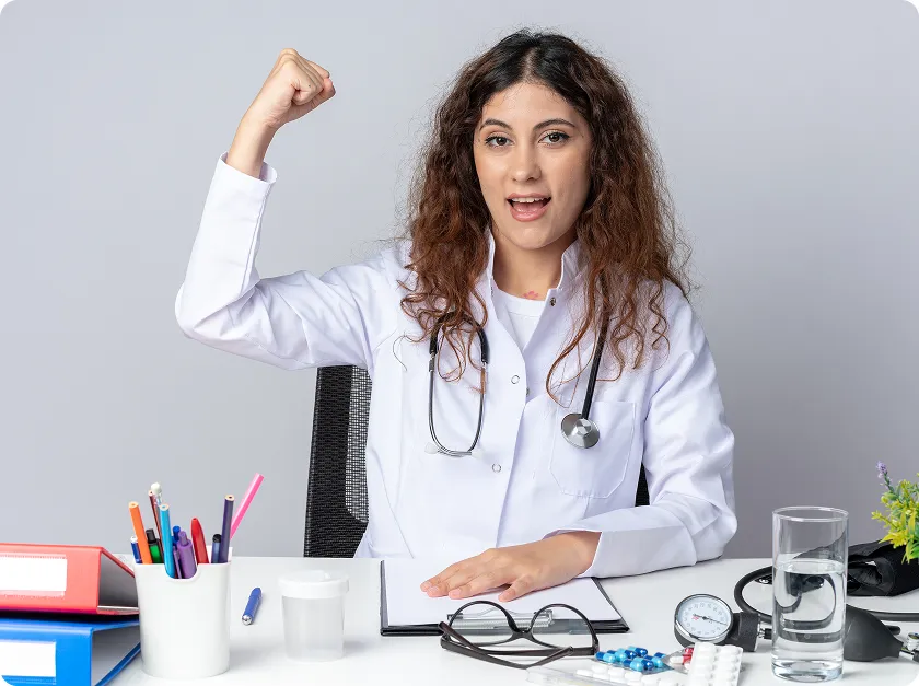 Female doctor raising fist, promoting magnesium glycinate benefits for women’s health
