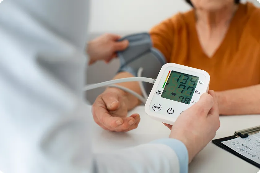 Doctor monitoring blood pressure to track vital heart numbers and what they mean.
