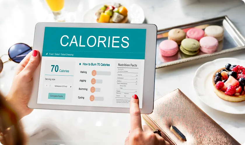 Tablet showing calorie data to help maintain a healthy heart vs unhealthy lifestyle.