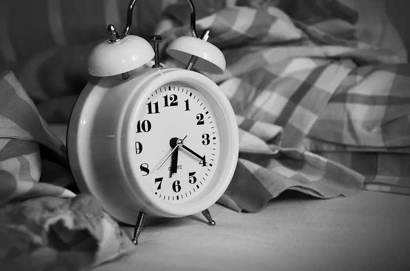 Alarm clock indicating morning for daily workout routine planning