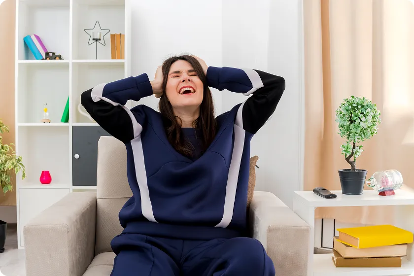 Woman holding head, relaxing with magnesium glycinate for stress relief