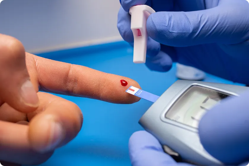 Finger-prick glucose test used to assess metabolic and cardiovascular levels accurately.