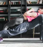 Couple performing partner push ups for arm workouts without equipment