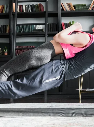 Couple performing partner push ups for arm workouts without equipment