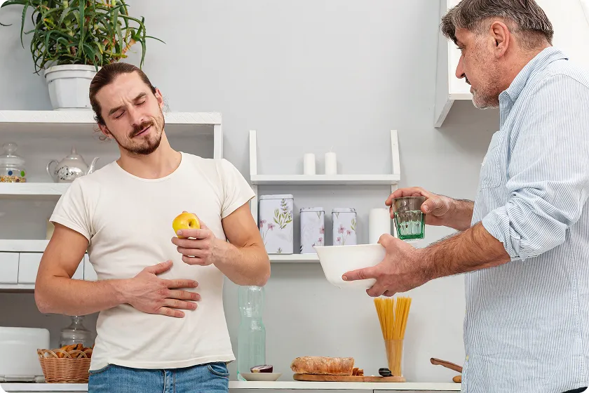 Man avoiding apple after learning what triggers gerd symptoms