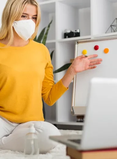 Masked teacher explains harmful microorganisms and infection vs disease online.