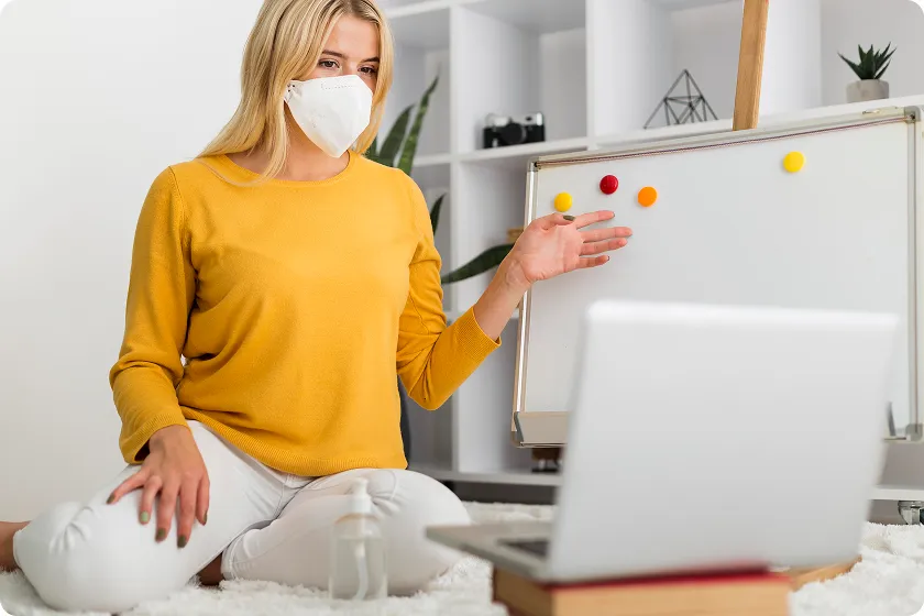 Masked teacher explains harmful microorganisms and infection vs disease online.