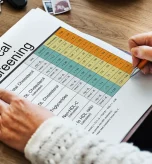 1 Person reviewing medical screening chart with statin potency chart and dosage insights.
