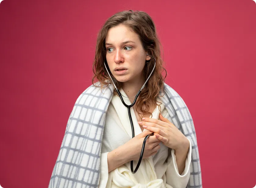 A worried woman holding a stethoscope to check for signs of heart failure in women.