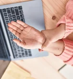 Hands showing painful finger joints and swelling from arthritis in hands.
