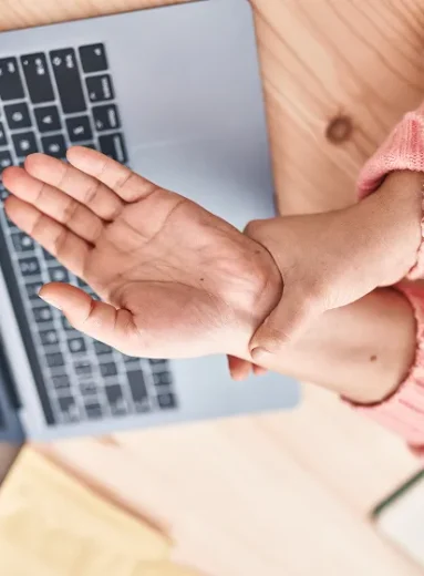 Hands showing painful finger joints and swelling from arthritis in hands.