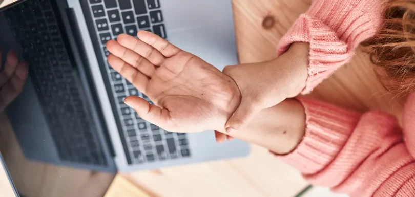 Hands showing painful finger joints and swelling from arthritis in hands.