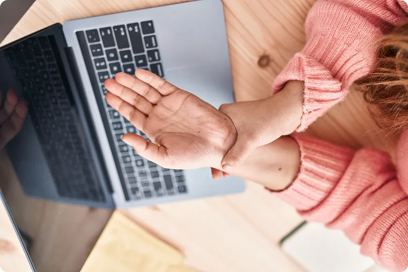 Hands showing painful finger joints and swelling from arthritis in hands.