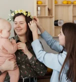 Happy mother holding her baby after a successful, healthy pregnancy after 40.