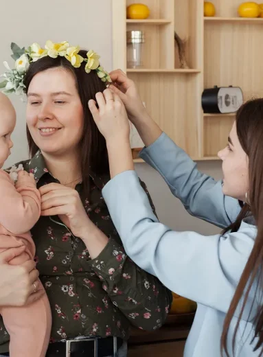Happy mother holding her baby after a successful, healthy pregnancy after 40.