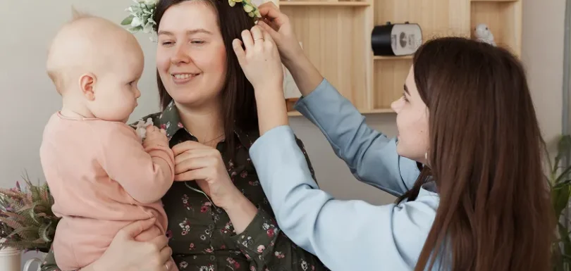 Happy mother holding her baby after a successful, healthy pregnancy after 40.