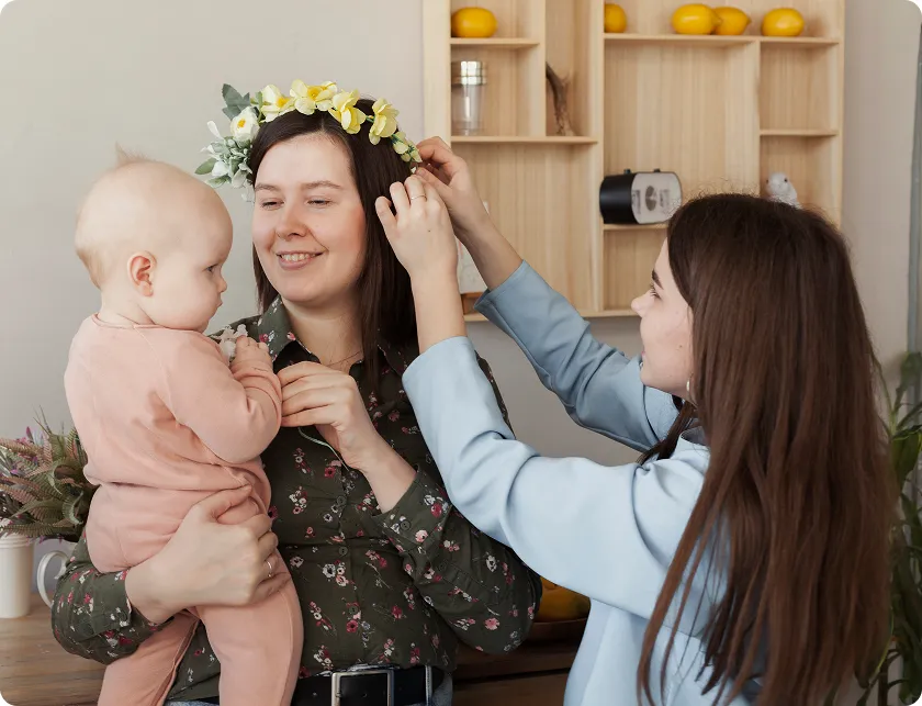Happy mother holding her baby after a successful, healthy pregnancy after 40.
