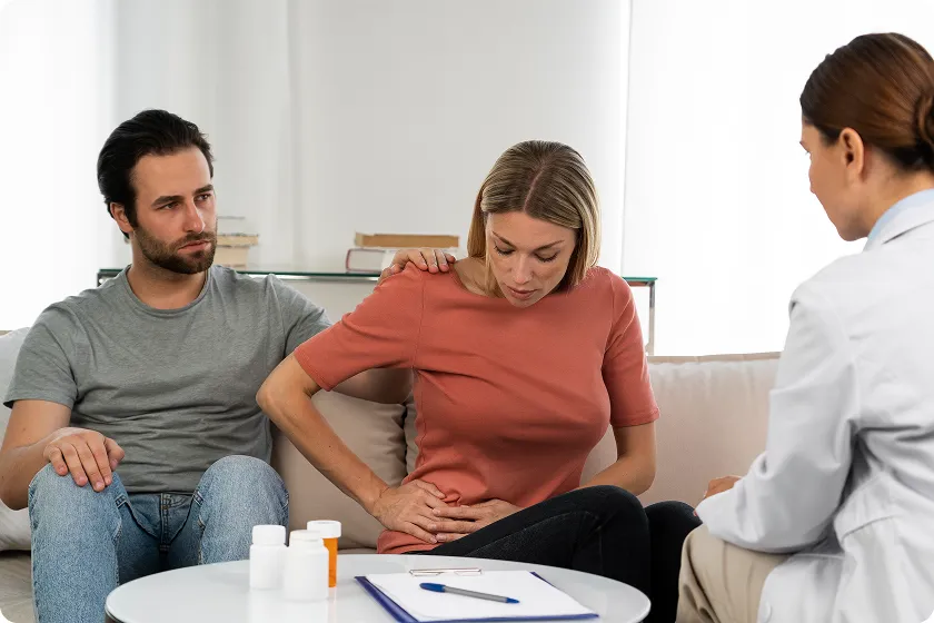 Woman discussing lupus kidney disease symptoms with a doctor during a consultation.