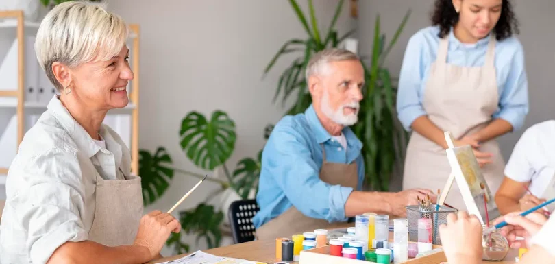 Elderly man learning daily routine schedule with caregiver support at home.