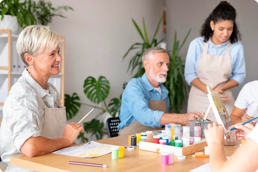 Elderly man learning daily routine schedule with caregiver support at home.