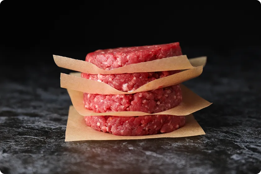 Stacked burger patties showing 80/20 ground beef calories context