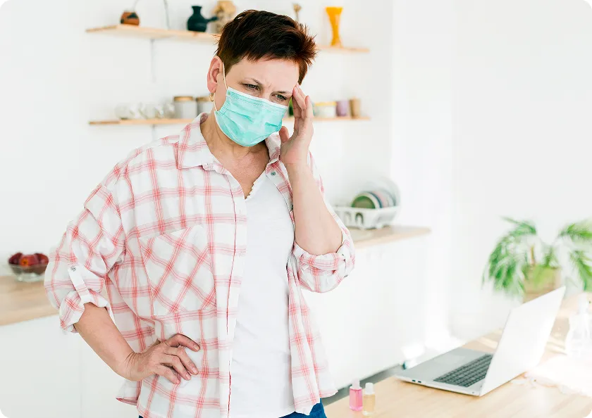Masked woman wonders can you get norovirus twice after first symptoms