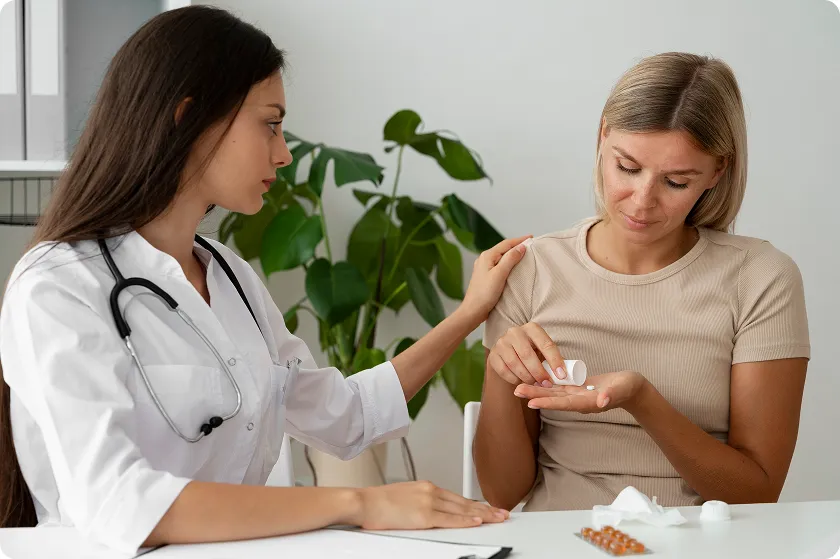 Healthcare professional discussing medication and early signs of lupus in females.