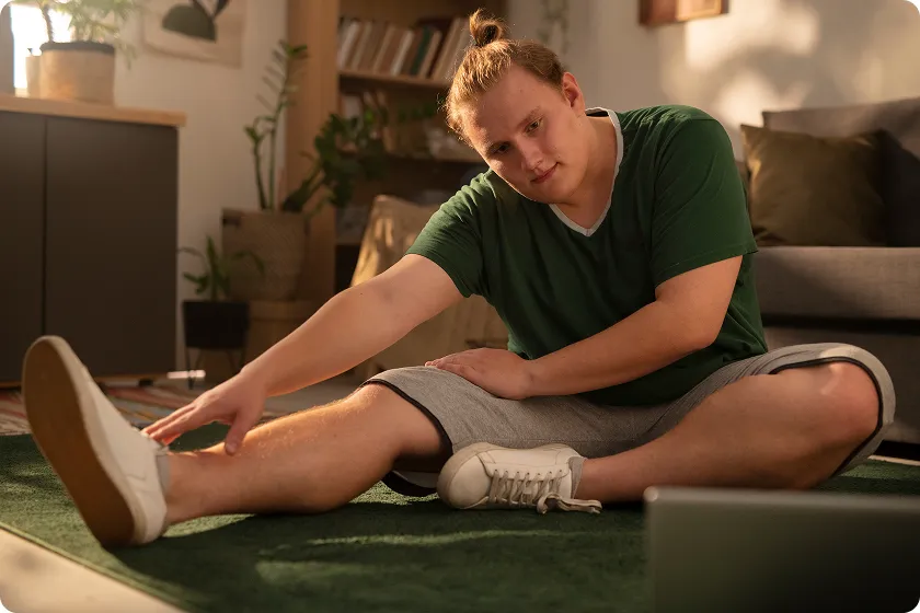 Woman trying home remedies for restless legs while relaxing on sofa