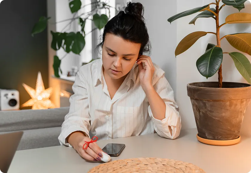 A woman sets health reminder for vaccines for older adults at home