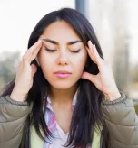 Woman learning what helps migraines to manage headache triggers