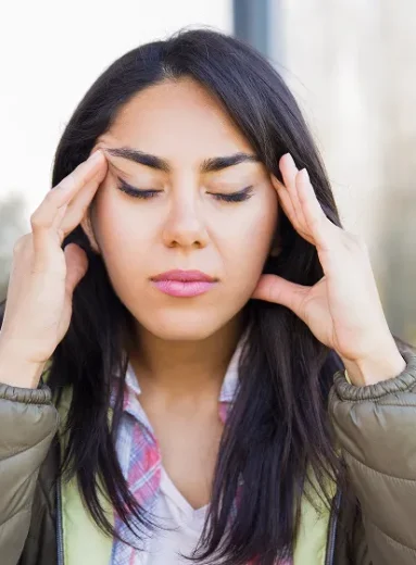 1 Woman learning what helps migraines to manage headache triggers