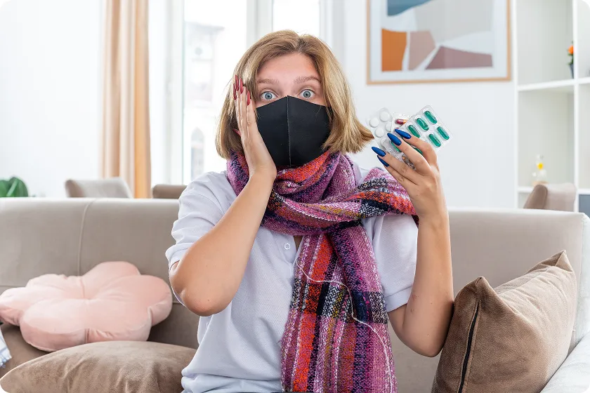 Woman surrounded by germs illustrating C diff infection symptoms