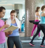 Fitness trainer explains cardio workout program for weight loss.
