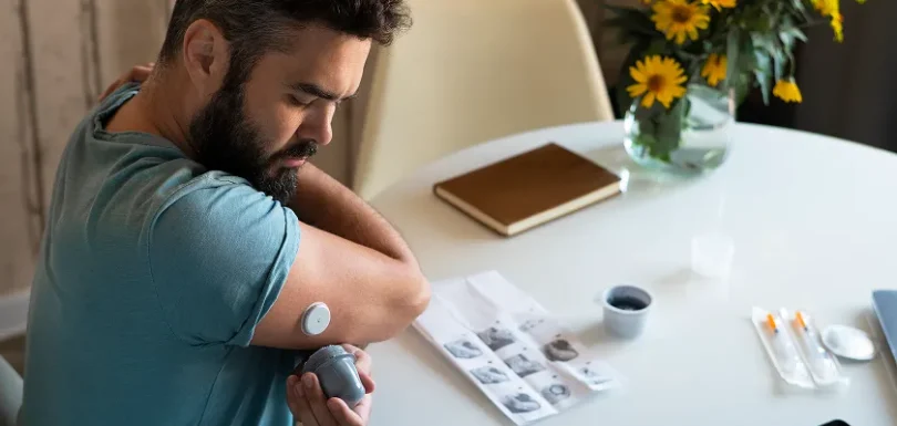 Person checking health readings to understand diabetes and fatigue symptoms