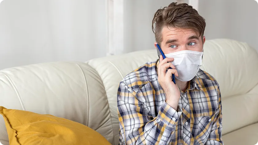 Masked woman checks temperature, asking is C diff dangerous